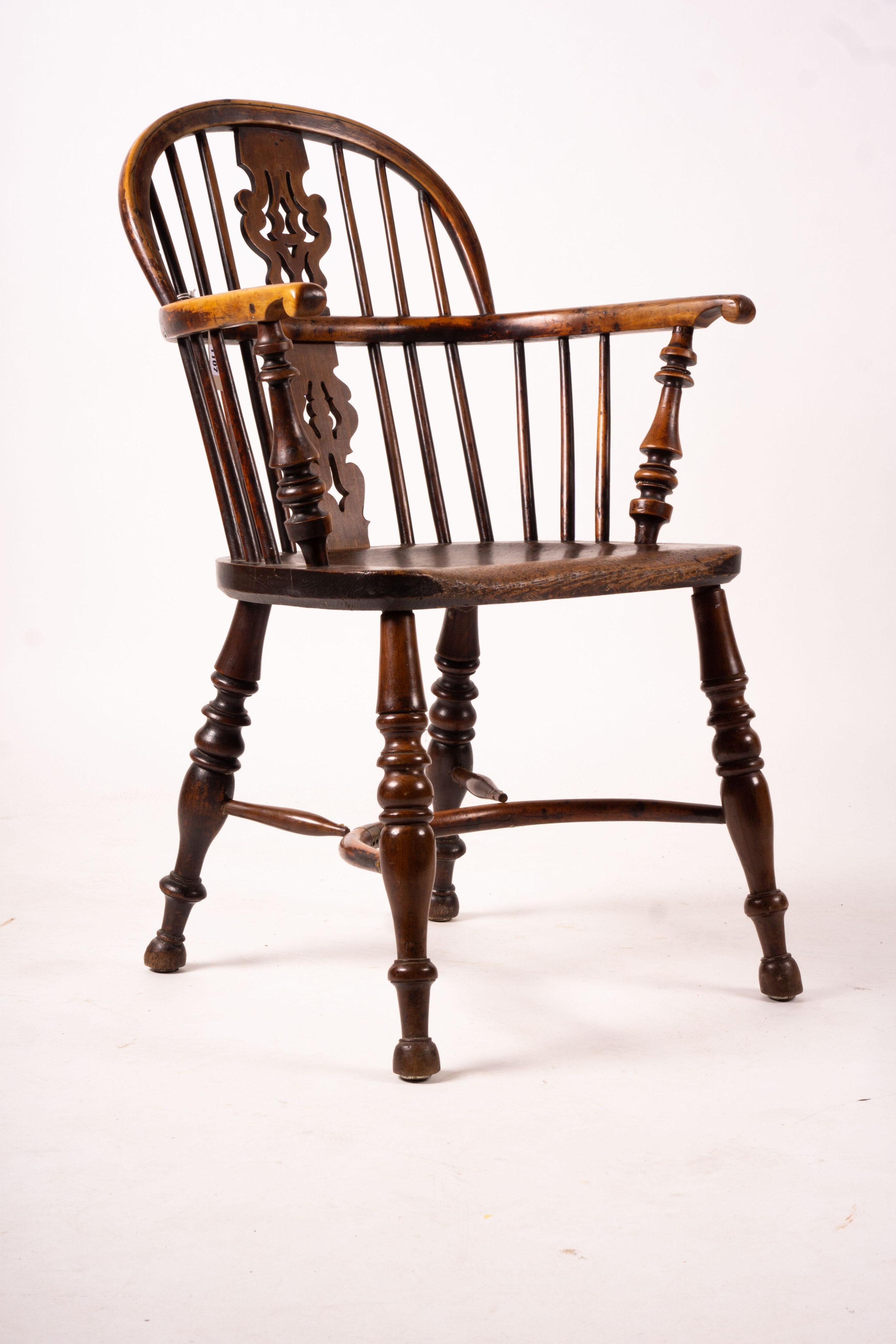 A 19th century yew and elm Yorkshire area Windsor elbow chair with crinoline stretcher, width 60cm, depth 45cm, height 93cm